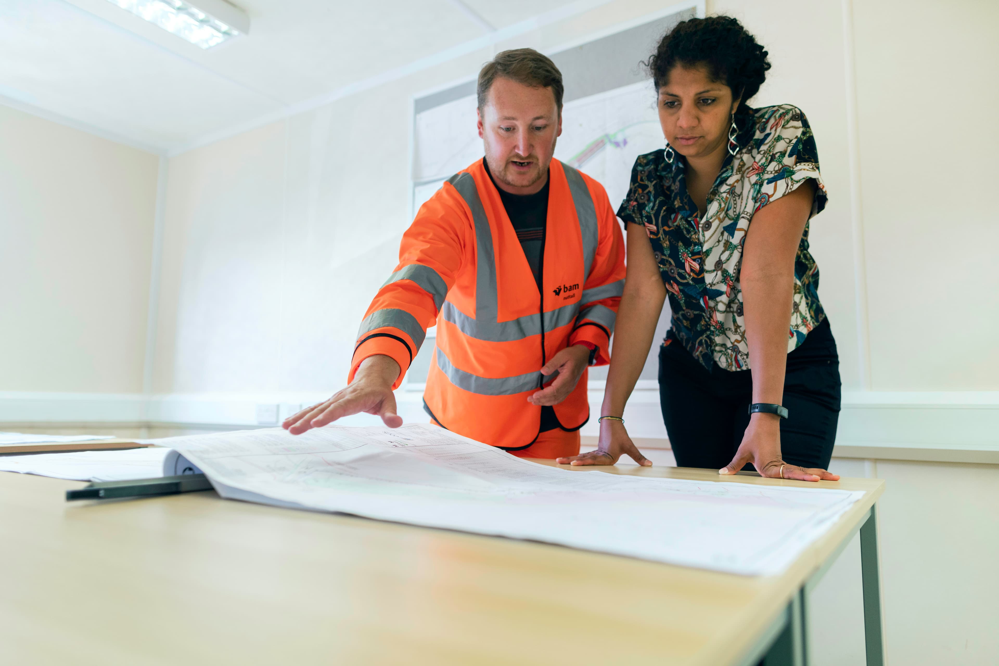 Engineers examining structural plans