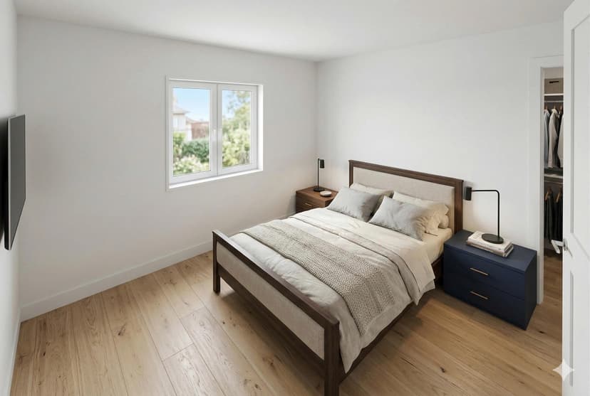 ADU primary bedroom with large windows and walk-in closet