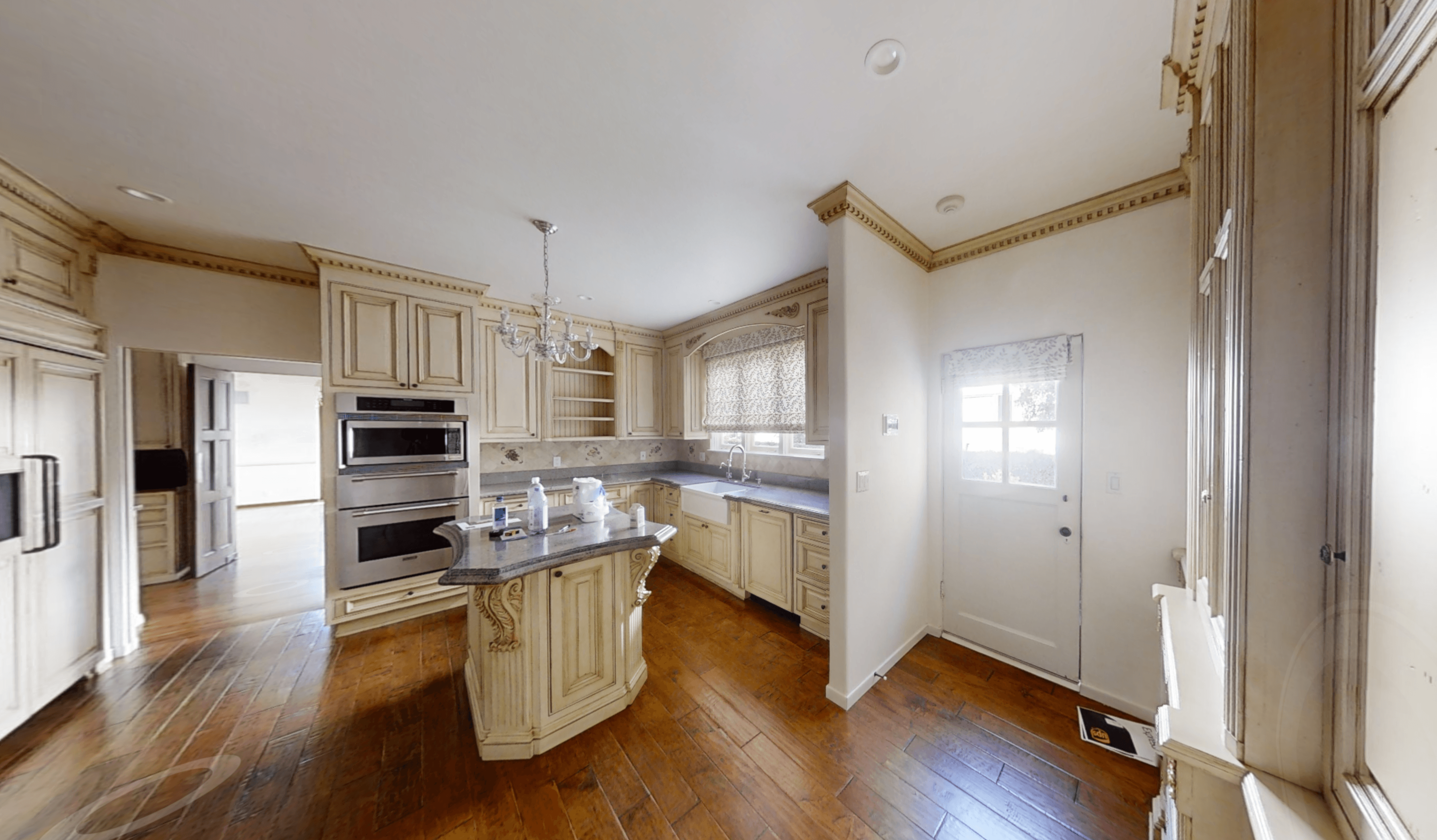Enclosed kitchen and living room before interior wall removal