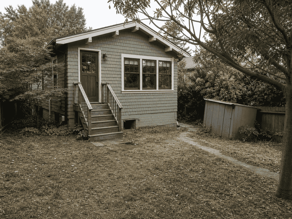 Sloped rear yard before construction of the level in-law wing