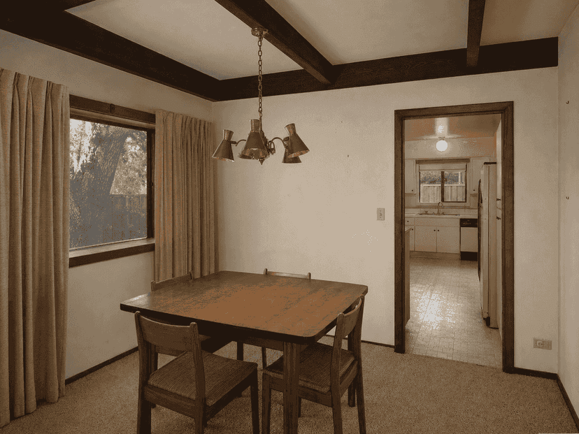 Closed-off dining room with limited garden connection before the remodel