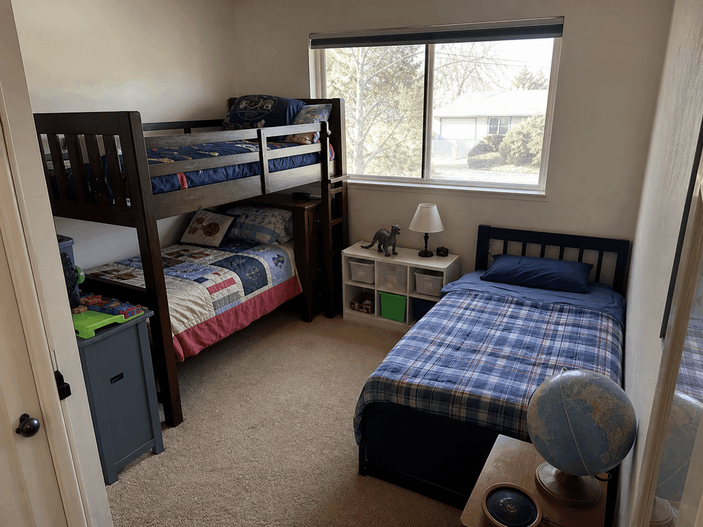 Small shared kids bedroom showing space constraints before the addition