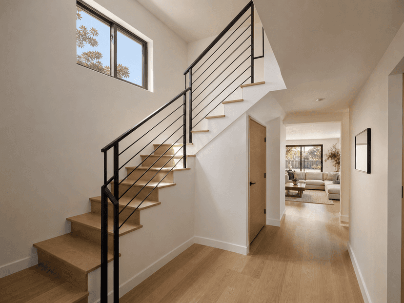 New central staircase connecting original living area to the second floor