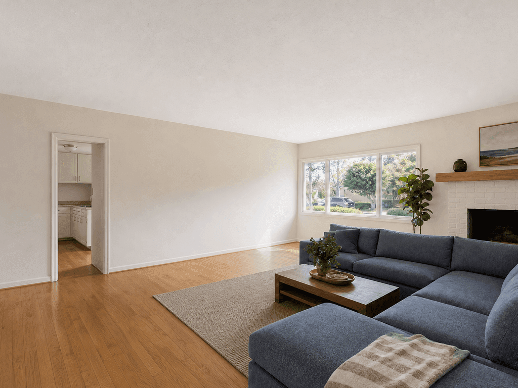 Closed San Mateo living room before the kitchen wall is removed