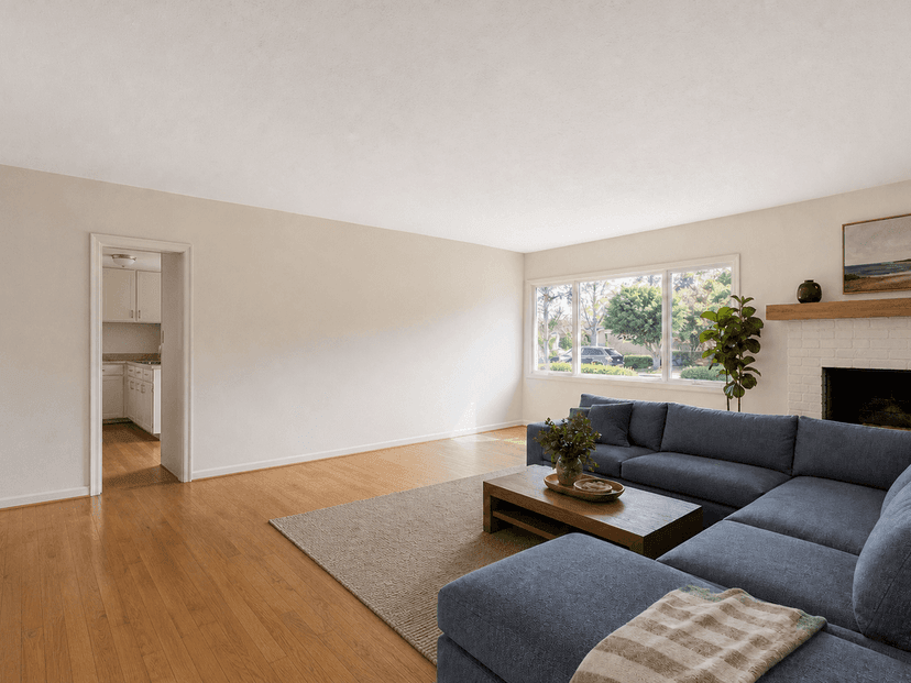 Closed San Mateo living room before the kitchen wall is removed