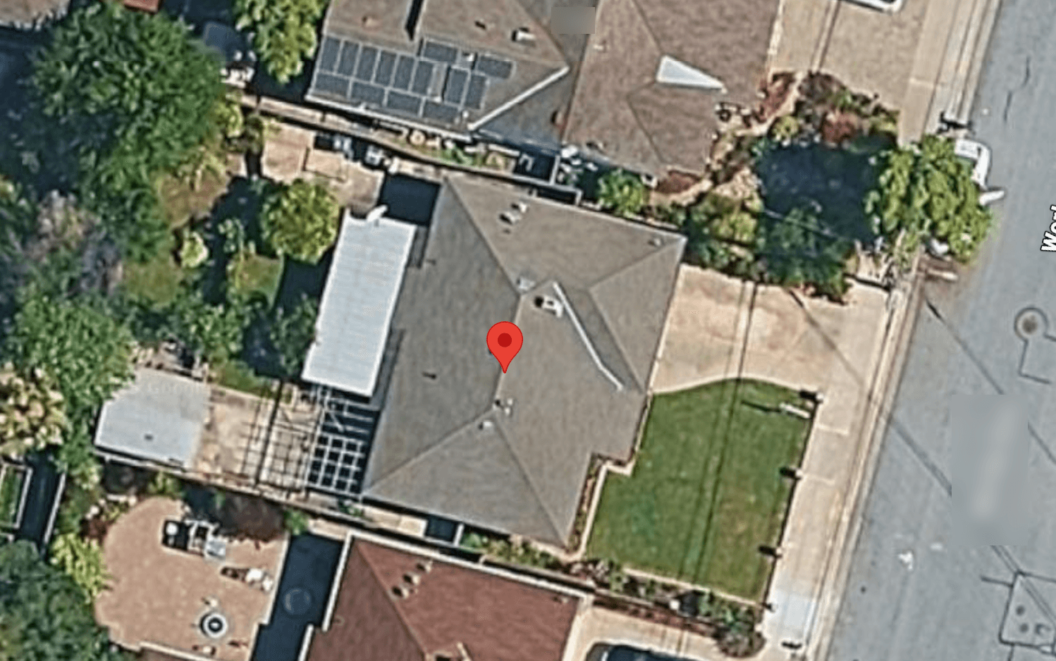 Aerial view of Sunnyvale home showing cramped rear yard and small patio before addition