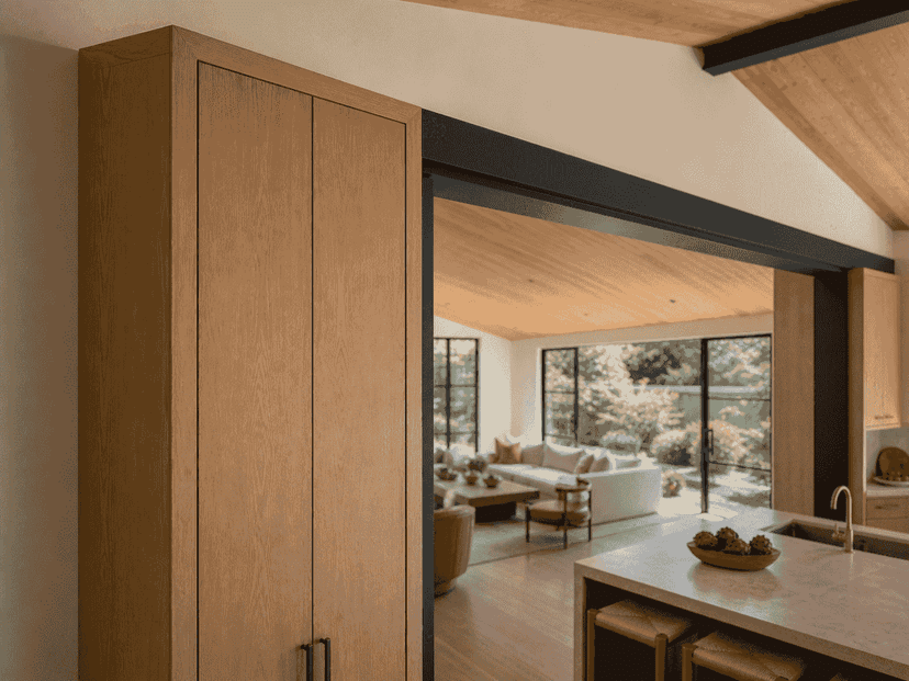 Moment-frame column integrated into a white oak cabinet pier